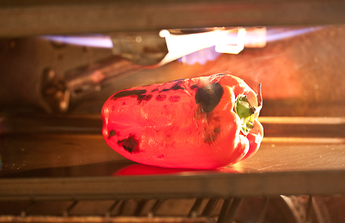Set the oven rack close to the broiler without jamming the pepper against the broiler