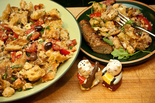 PanzanellaPlate Panzanella along with a grilled gourmet sausage and a couple of serenading piggies