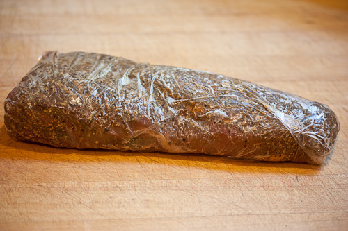 Wrapping the beef tightly in plastic wrap helps to "dry marinate" it