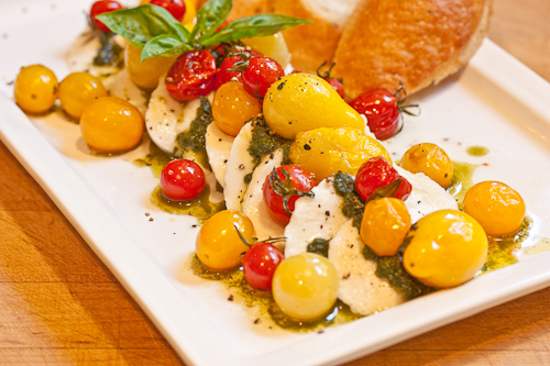 The heat of the tomatoes softens the fresh mozzarella