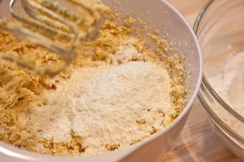 Use a low speed to beat in the flour and don't overmix
