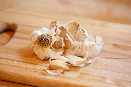 The force of the smack will break the cloves away from the root -- sometimes you need to give it another go but this was a dry head of garlic and broke up more than I'd have liked it to