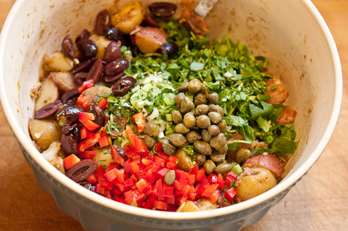 I like to have a color balance -- and balance the sweet (pepper) with salty (olives & capers) and tart (greens)