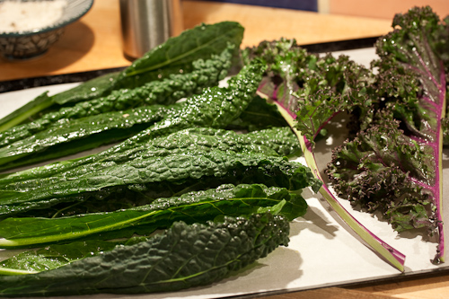 Rinse and pat dry the kale, lightly spray with olive oil, and sprinkle with salt. Shown here is Russian Kale (Dinosaur or Dino Kale) and Purple Kale