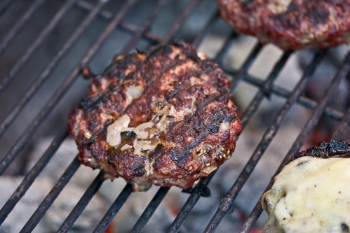 The burgers start to release some juice on the top when they are done