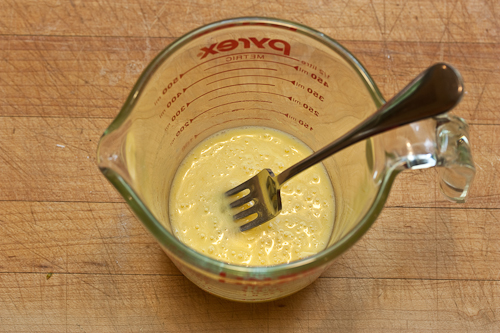 EggButterMix The protein in the egg binds with the butterfat, making this a smooth emulsion rather than the recongealed butter bits you'd get if you added cold milk first