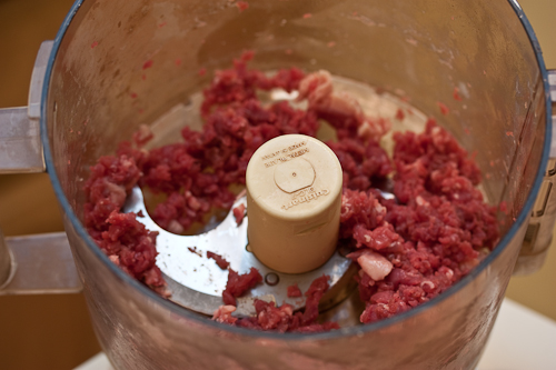 Don't overload the bowl and check it several times while you pulse so that you don't overprocess the meat