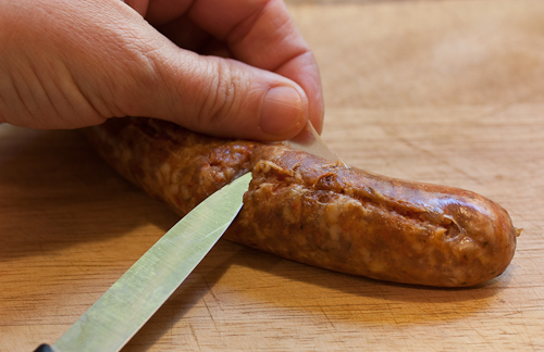 SausageSlice With the tip of a sharp knife, make a long slit in the sausage casing