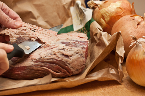 The butcher can do this for you if you ask, but the brisket is by nature a somewhat "fatty" cut