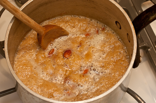 Now the nuts are beginning to pop and over high, the mixture gets foamy